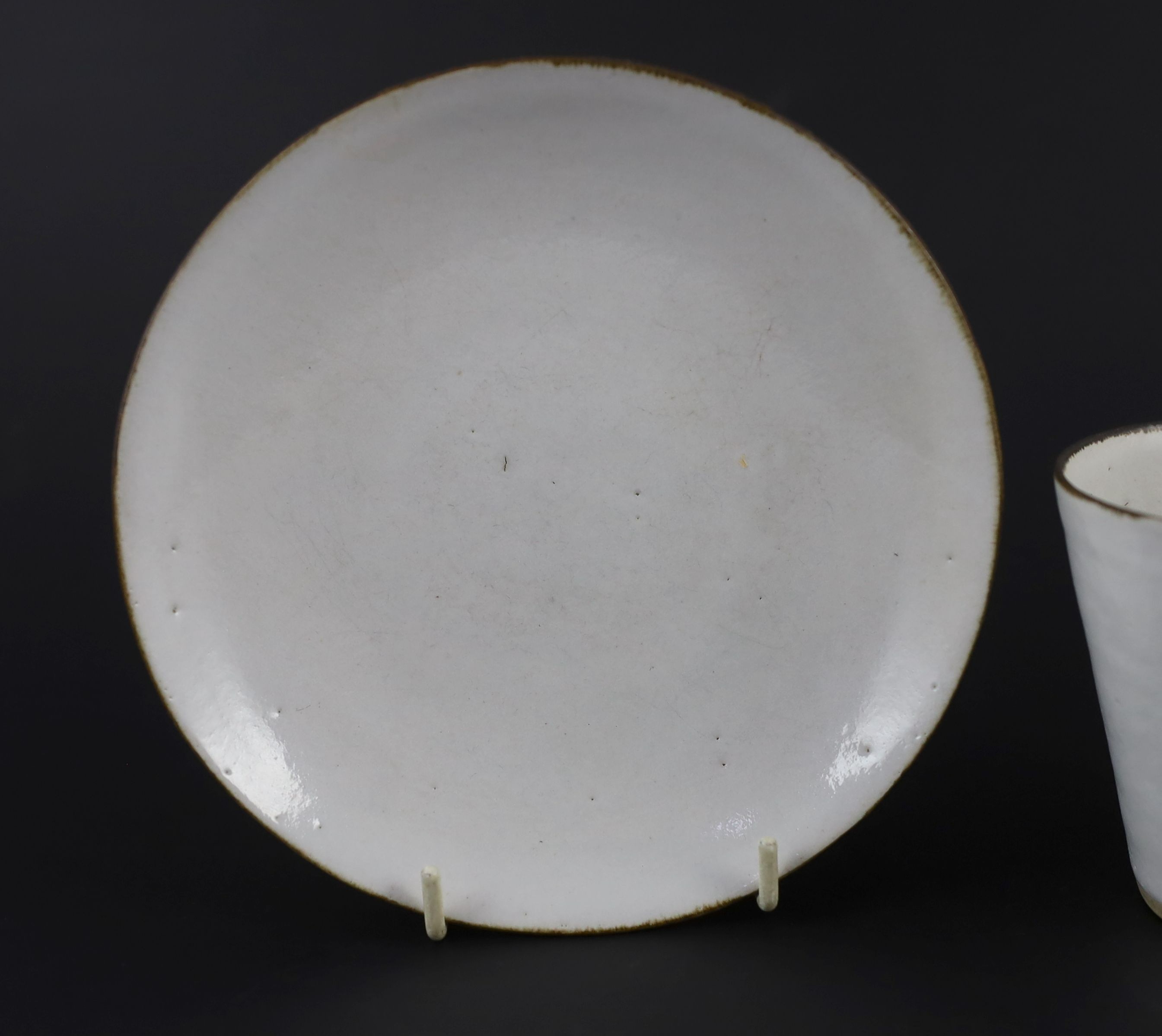 Dame Lucie Rie (1902-1995) a cup, saucer and side plate, c.1959, Cup 8 cm high